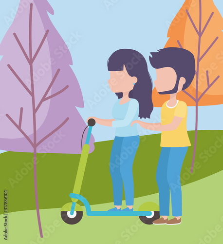young woman riding scooter and man walk in the meadow healthy lifestyle