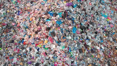 Aerial top down view through Trash on landfill site, pollution environmental problem