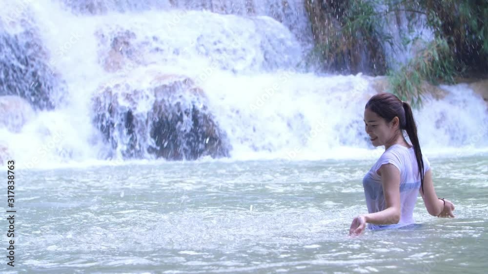 Asian Woman Playing In Waterfall Asian Woman Playing In Waterfall