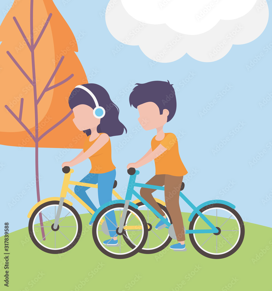 couple riding bike, woman with headphones in the grass healthy lifestyle couple riding bike, woman with headphones in the grass healthy lifestyle
