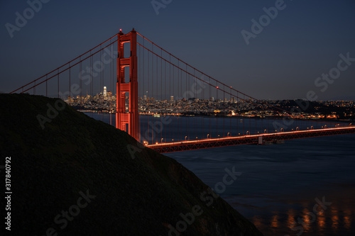 Lights of the Golden Gate Reflect in the Water Below