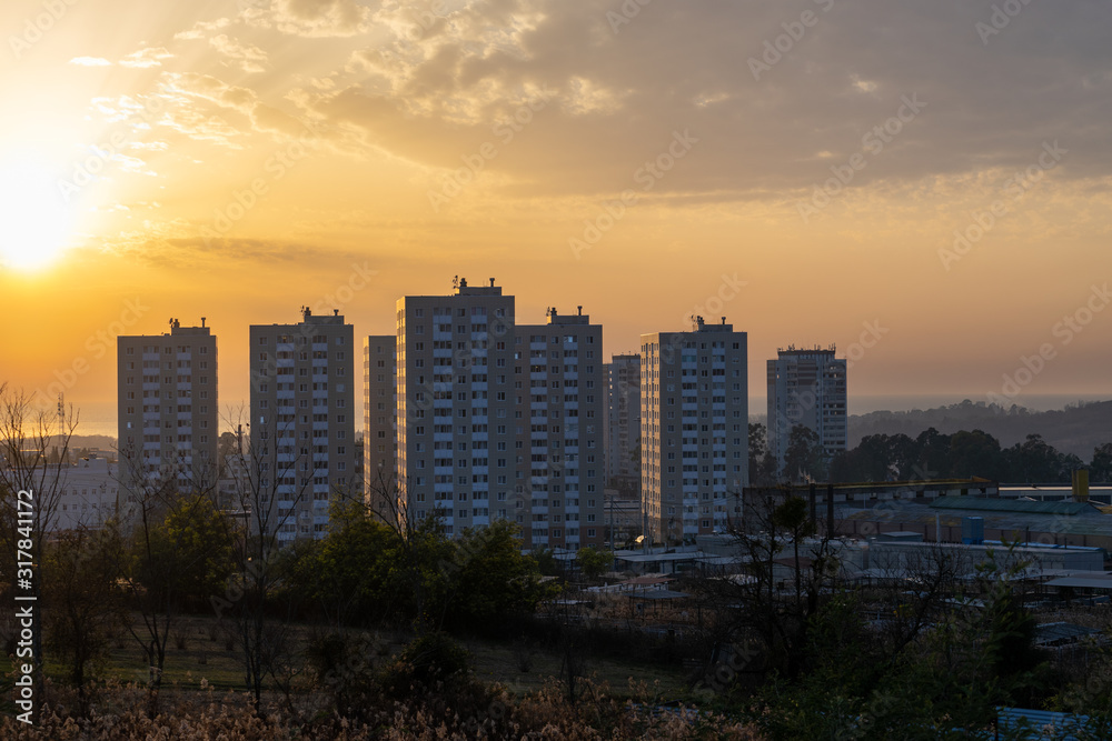 City landscape with sunset background.
