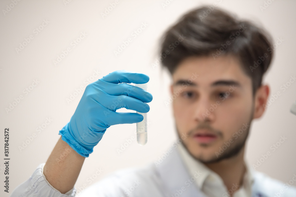 Scientists are examining specimens in the hospital's laboratory. Scientists are examining specimens in the hospital's laboratory.