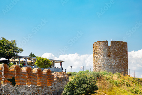 Ancient ruins Old windmill and church of the holy mother eleusa in Nessebar, Bulgaria photo