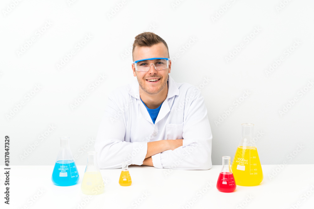 Young scientific with lots of laboratory flask laughing Young scientific with lots of laboratory flask laughing