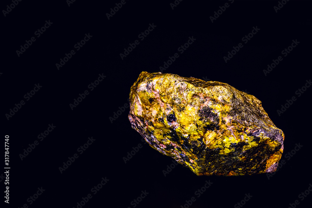 uranium mineral isolated on black background. Highly radioactive and dangerous ore. uranium mineral isolated on black background. Highly radioactive and dangerous ore.