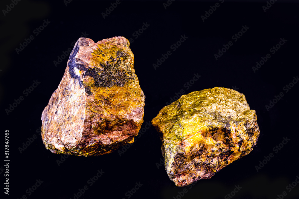 uranium mineral isolated on black background. Highly radioactive and dangerous ore. uranium mineral isolated on black background. Highly radioactive and dangerous ore.