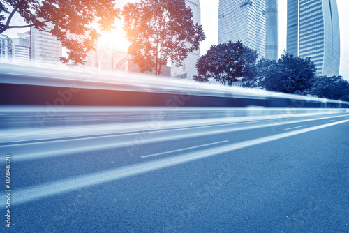 busy asphalt road in modern city under twilight photo