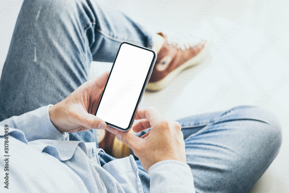 Mockup image blank white screen cell phone.men hand holding texting using mobile. background empty space for advertise text.people contact marketing business and technology Mockup image blank white screen cell phone.men hand holding texting using mobile. background empty space for advertise text.people contact marketing business and technology