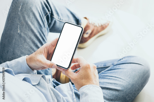 Mockup image blank white screen cell phone.men hand holding texting using mobile. background empty space for advertise text.people contact marketing business and technology