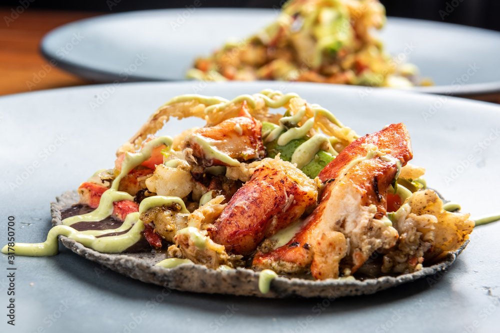 Mexican lobster taco in a black corn tortilla Mexican lobster taco in a black corn tortilla