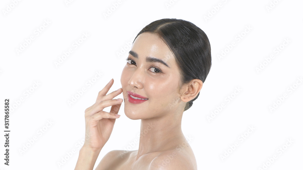 Beauty concept. A beautiful woman is gently caressing her face on a white background. 4k Resolution.