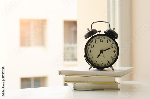 Alarm clock and books