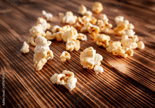 Popcorn flakes on a wooden background