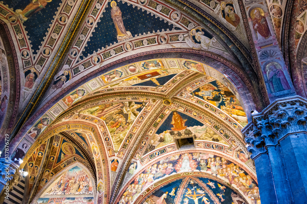 Siena, Italy - CIRCA 2013: Baptistery of Saint John (Battistero di San Giovanni) ceiling interior in Siena Cathedral complex.