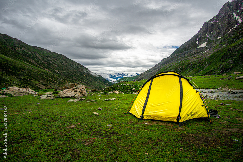 Tent pitched with a view of the valley