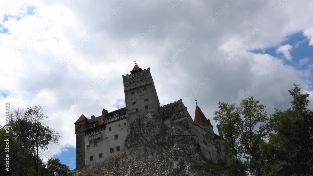 Timelapse of fluffy white clouds over Dracula's (Bran's) Castle in Transylvania, Romania Timelapse of fluffy white clouds over Dracula's (Bran's) Castle in Transylvania, Romania