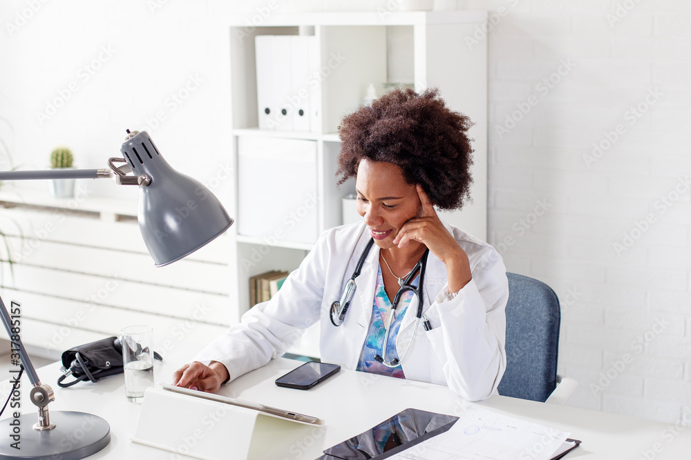 Woman doctor sitting in ambulance office and smile while wait patients Woman doctor sitting in ambulance office and smile while wait patients