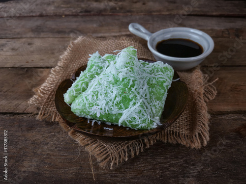 A Malay traditional dessert called Kuih Lopes on wooden background 