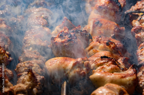 Shish kebab roasting on the grill