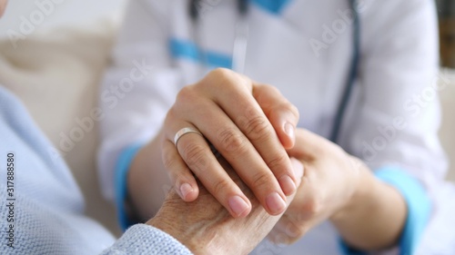 Closeup Of Doctor Keeping Hand Of Senior Patient