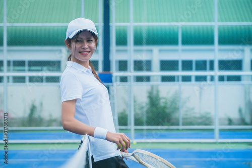 Sport concept; Young people playing tennis on court and relaxing of sport