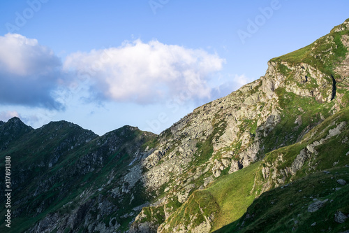 Sunrise on Fagaras high mountain ridge. Romanian mountain landscape with high peaks over 2200m