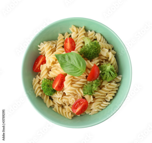 Tasty pasta with broccoli, cherry tomatoes and basil isolated on white, top view