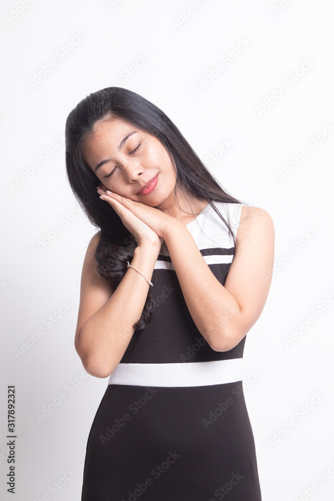 Beautiful young Asian woman with sleeping gesture. Beautiful young Asian woman with sleeping gesture.