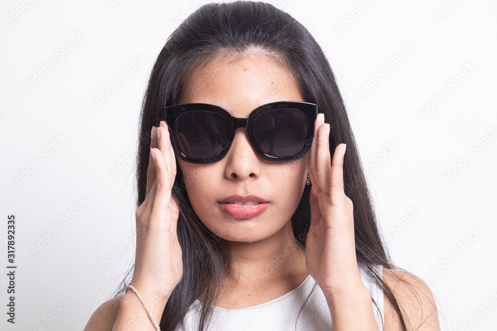 Portrait of a beautiful young asian girl in sunglasses.