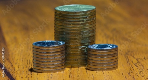 stack of coins on wooden table