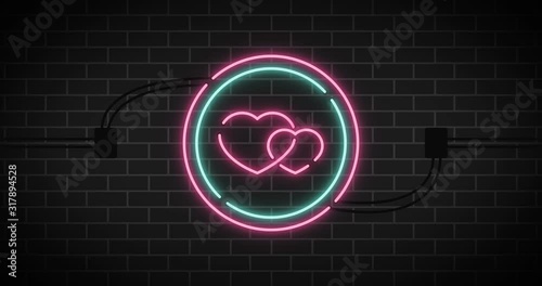 Neon sign.Valentine sign on brick background.
