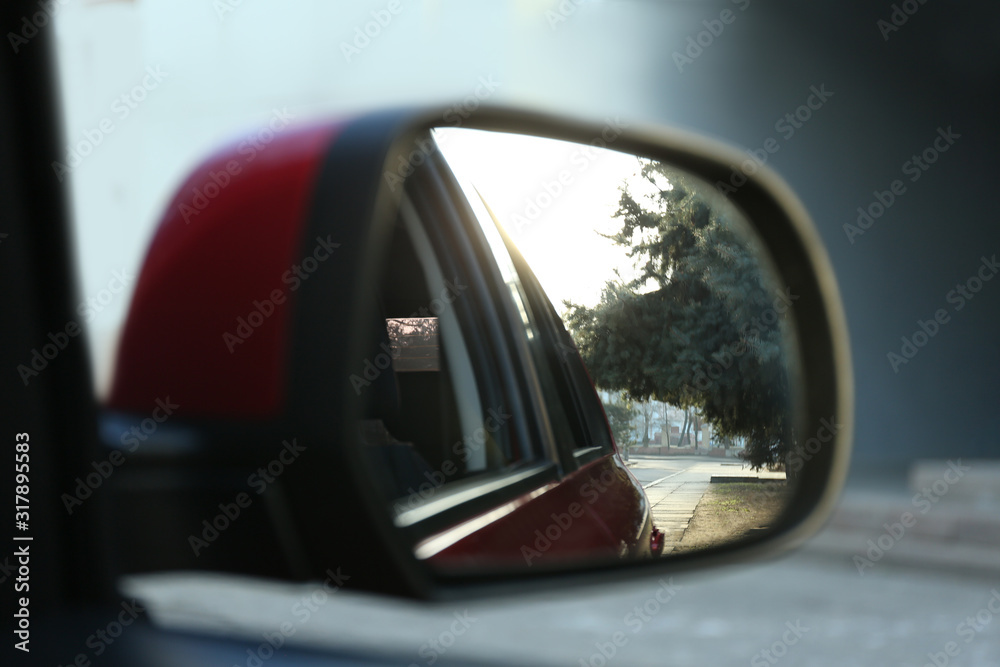 Side rear view mirror of modern car outdoors, closeup