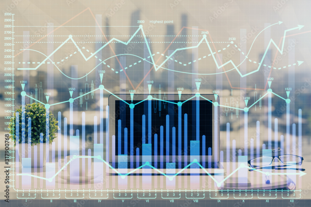 Forex market chart hologram and personal computer background. Double exposure. Concept of investment. Forex market chart hologram and personal computer background. Double exposure. Concept of investment.