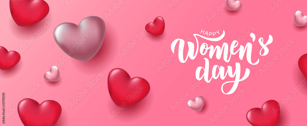 Happy Woman’s Day hand lettering text with realistic looking pink hearts. Vector illustration. 8 March greeting calligraphy design. Template for a poster, cards, banner.