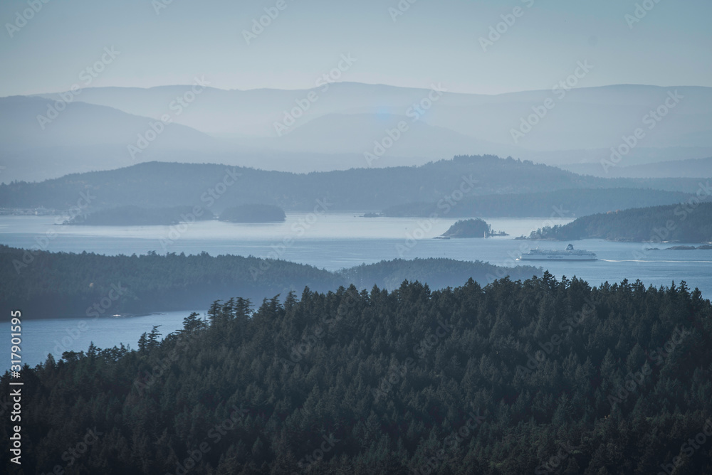 Misty morning view in between Islands from Pender Island Gulf islands Vancouver British columbia canada foggy day mountain top view with ocean 