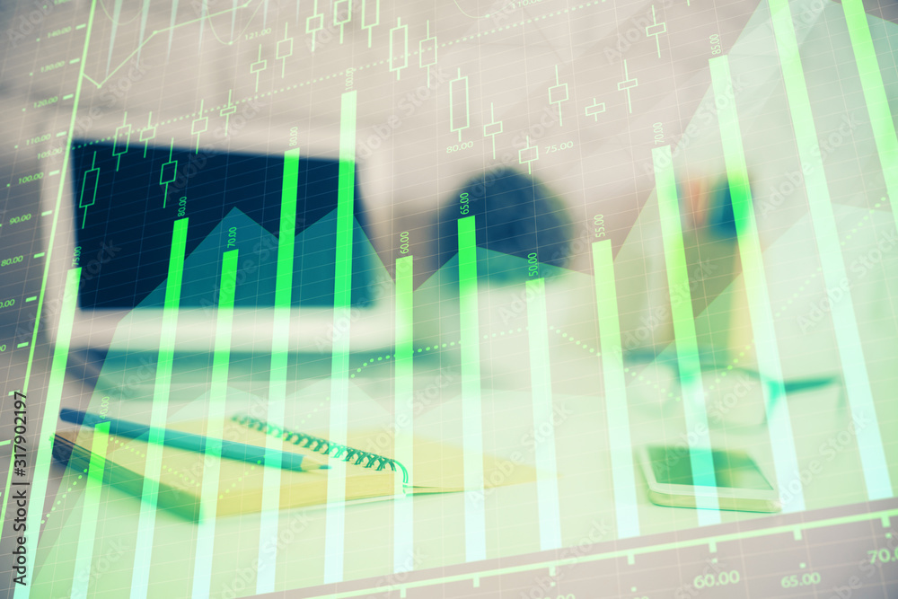 Forex graph hologram on table with computer background. Multi exposure. Concept of financial markets. Forex graph hologram on table with computer background. Multi exposure. Concept of financial markets.