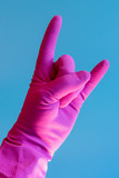 Hand with cleaning glove making fist. vertical photo