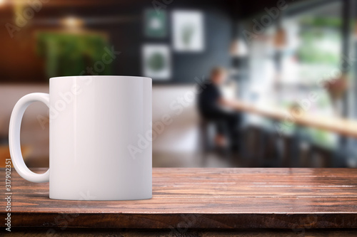 White coffee Mug Mockup set-up in a cafe, with blurred background. Great for overlaying your custom quotes and designs for selling mugs.