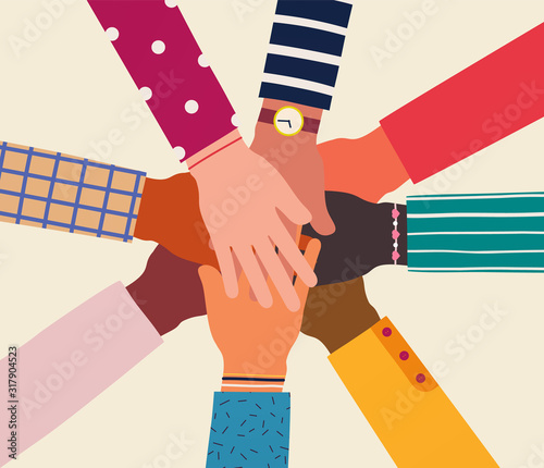 Hands of diverse group of people together. Concept of support and cooperation, friendship, volunteering charity.