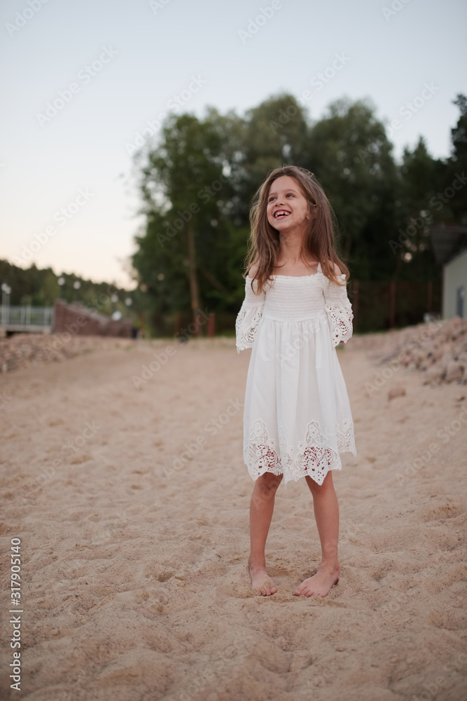 young beautiful girl with long hair on the beach young beautiful girl with long hair on the beach