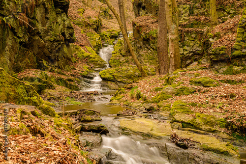 waterfall cascades on a creek in rocks