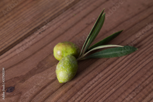 olives with branch on wood