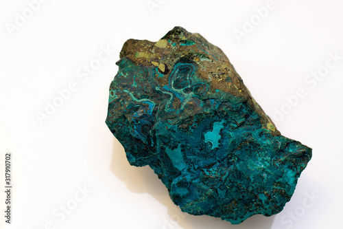 copper ore from a copper mine in Chile, a green stone on a white background. photo