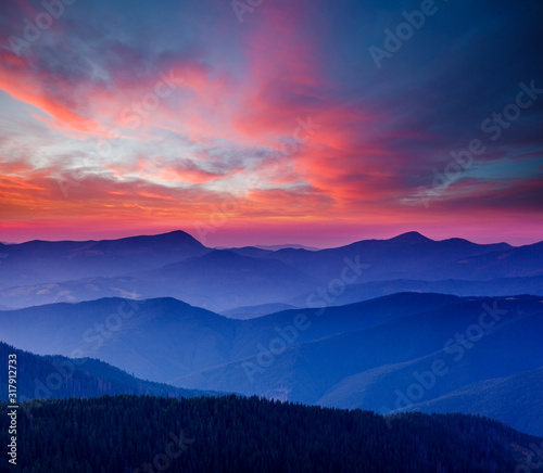Calm evening landscape in the mountains at sunset. © Leonid Tit