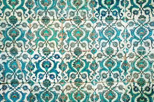Canvas Print Medieval era glazed tile wall of intricate blue hand painted floral patterns in