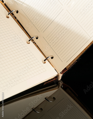 Wallpaper Mural diary with a wooden cover open for writing a business plan, notebook close-up Torontodigital.ca