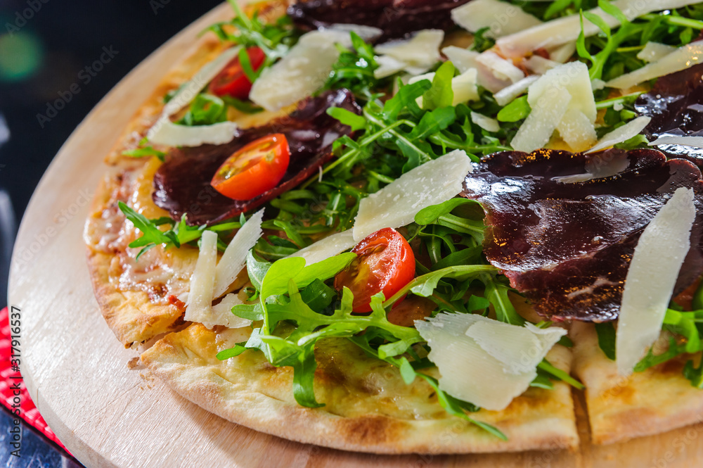 Pizza on table close up.Cut pizza.Italian traditional dish. Pizza on table close up.Cut pizza.Italian traditional dish.