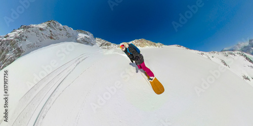 SELFIE: Young woman is stoked to be heliboarding in sunny British Columbia. photo