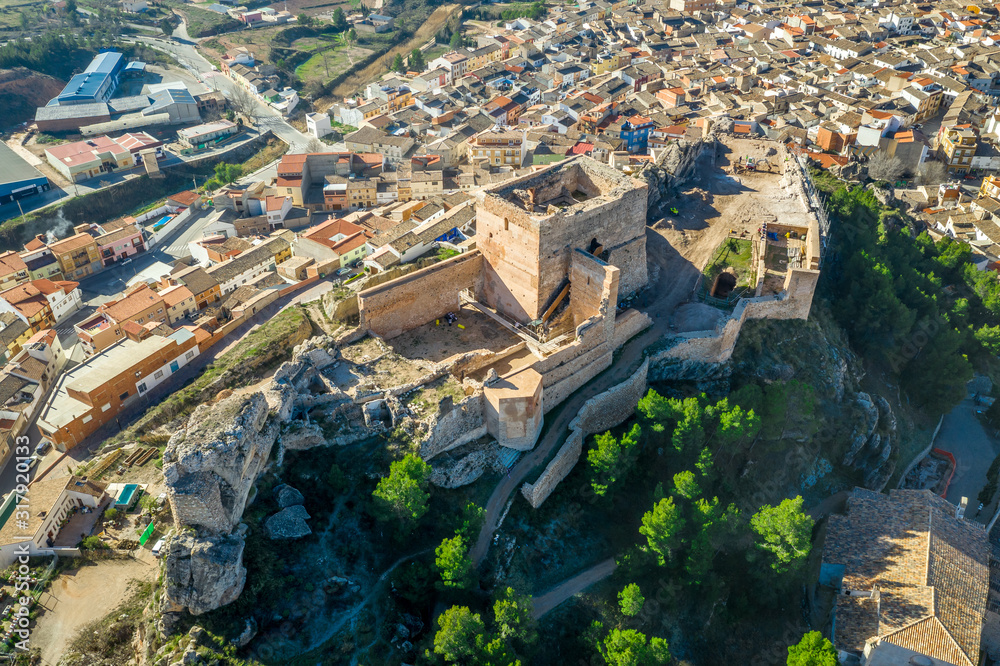 Fototapeta premium Aerial panoramic view of medieval Ayora castle of Arab origin currently under restoration above the town in Spain